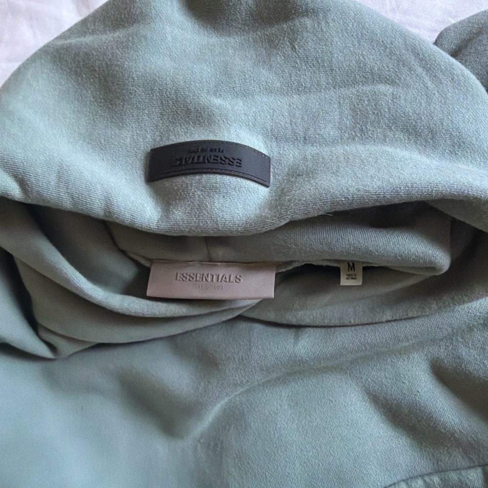 Essentials Sage Green Hoodie with Rubber Logo Patch - Picture 2 of 3